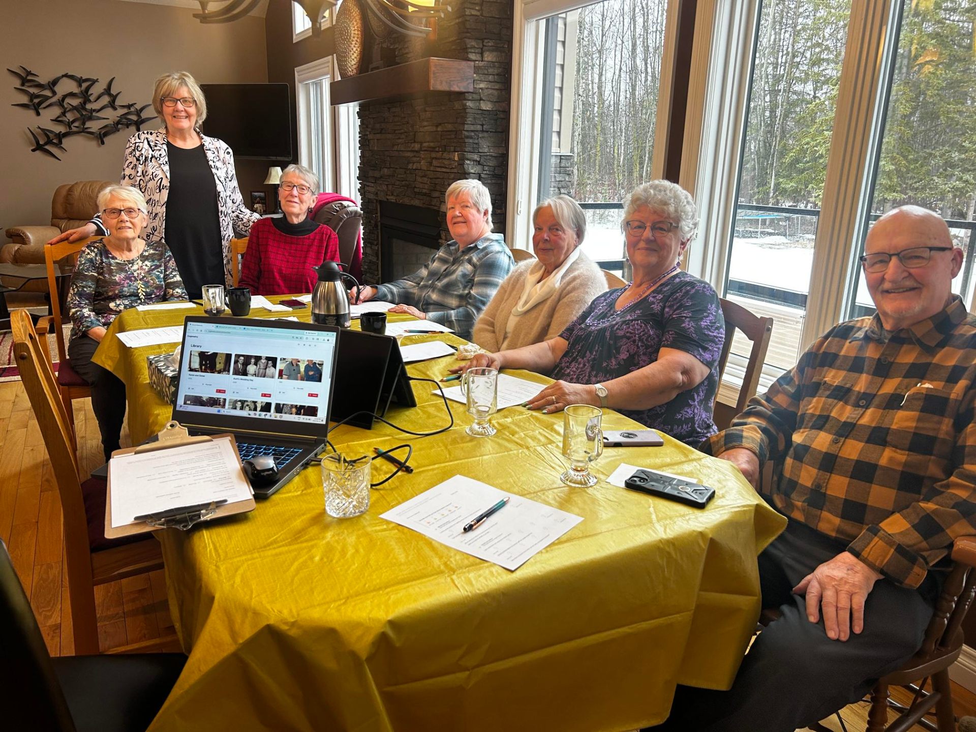 A Life Story Café group gathered around a table sharing memories